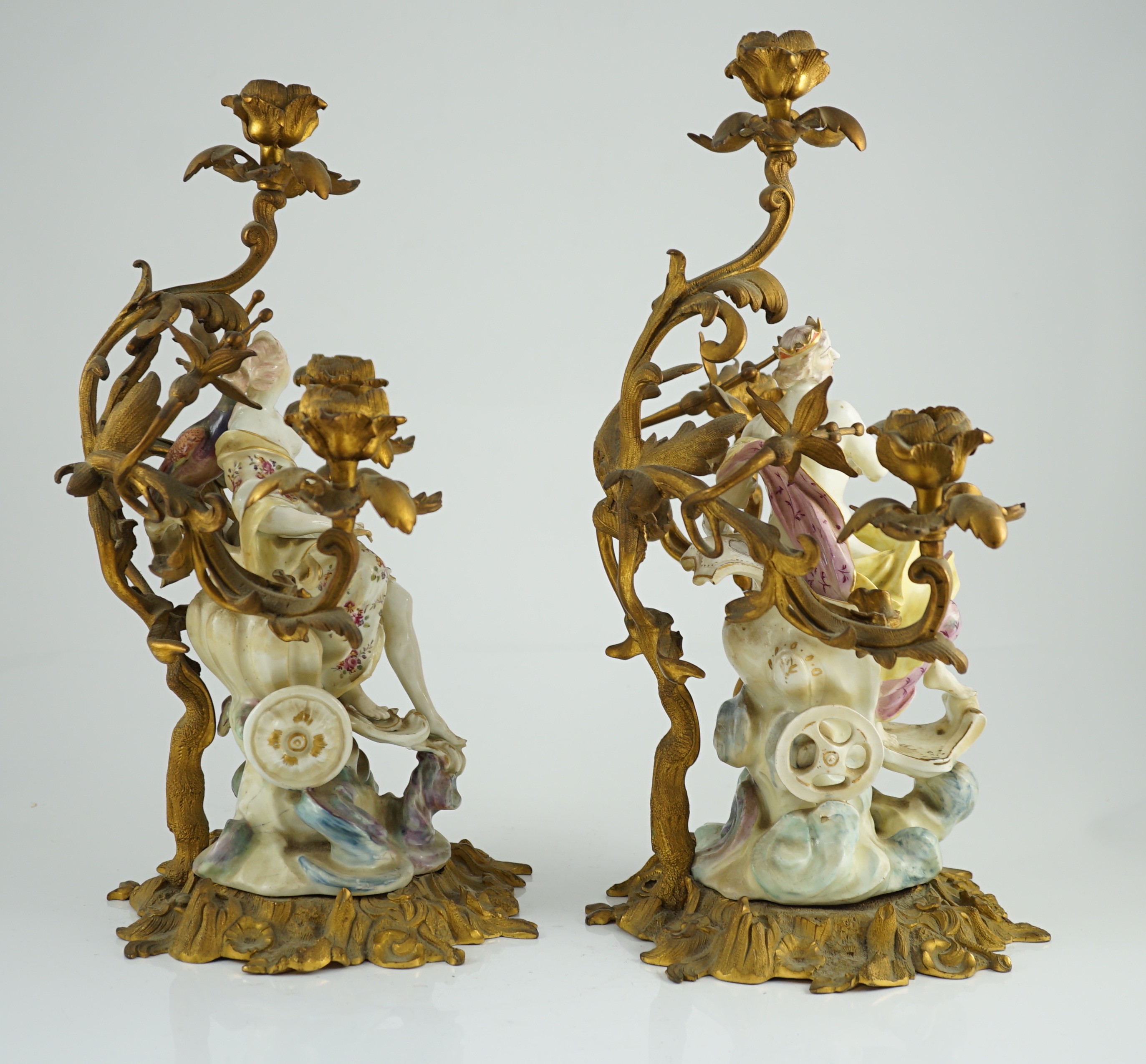 A pair of large Derby porcelain and ormolu mounted ‘Juno and Jupiter’ figural candelabra, the figures c.1760